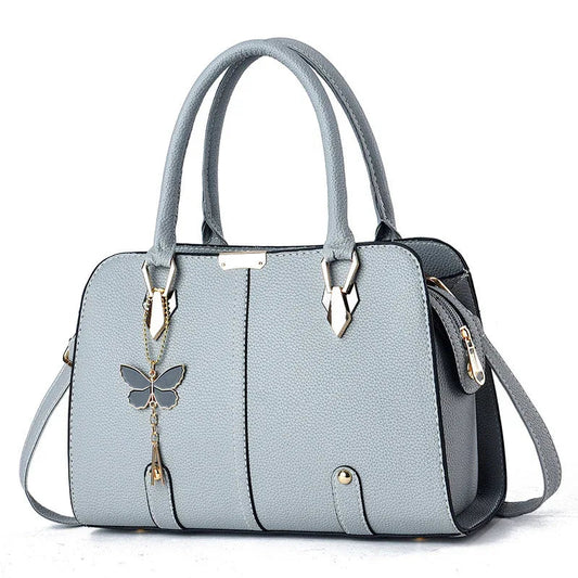 Modische Damen-Handtasche aus PU-Leder mit Schmetterlingsanhänger