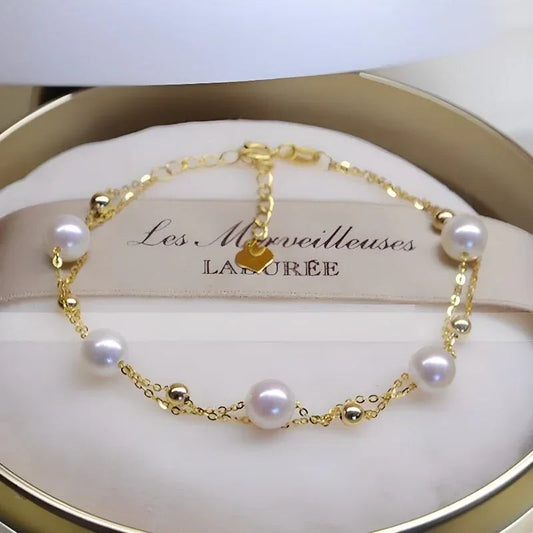 Damenarmband mit 18 Karat Gold und zweireihigen Salzwasserperlen